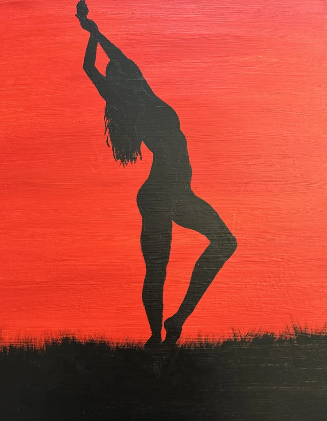 Dancing silhouette against a vivid red background
